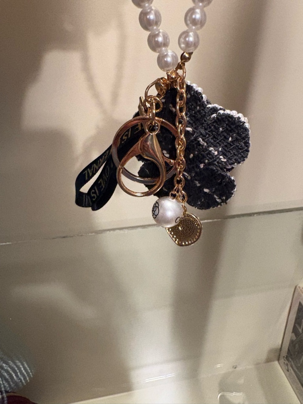 Pearl-Accented Black Flower Keychain with Gold Hardware - Picture 3 of 3
